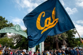Photo of Cal flag on Sproul Plaza in front of Sather Gate