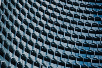 building facade with hexagons photo by chuttersnap