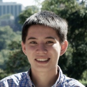 Isaac Liu in front of trees, building in Washington, DC