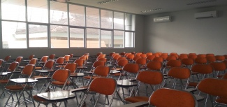 empty classroom with desks and chairs