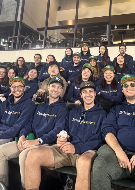 A photo of MA Statistics students sitting in a baseball stadium